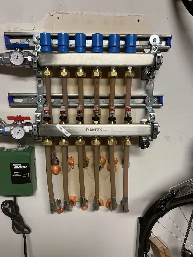 Plumber performing Water Heater Repair at a residential property in Waynesville